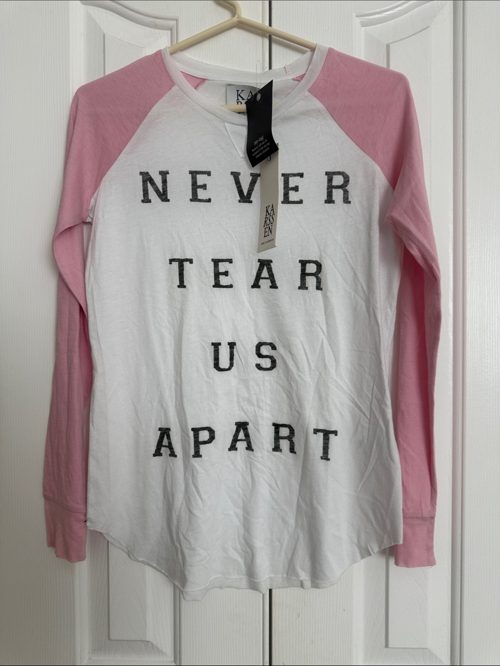 ZWhite & Pink Raglan Shirt with 'Never Tear Us Apart' Graphic